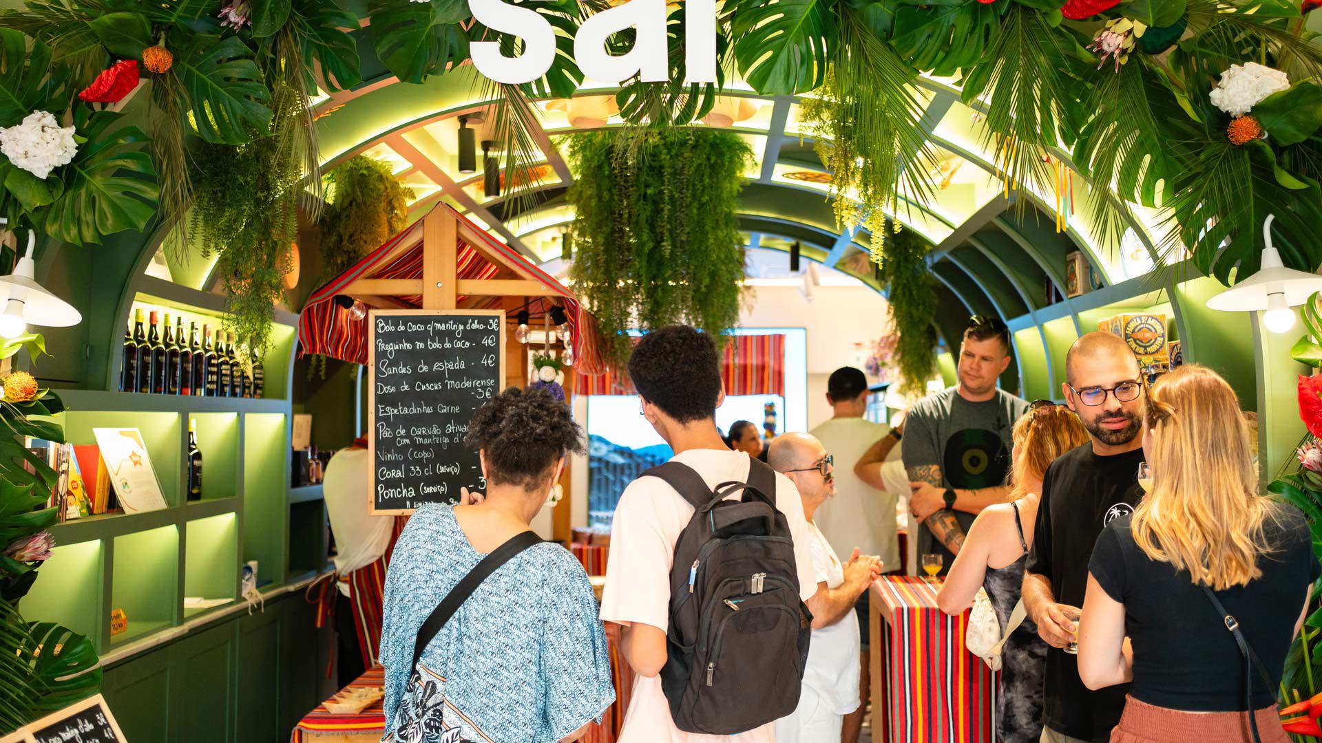 "SAL" event at the Madeira Tourism Office in Lisbon with themed decoration and people participating.