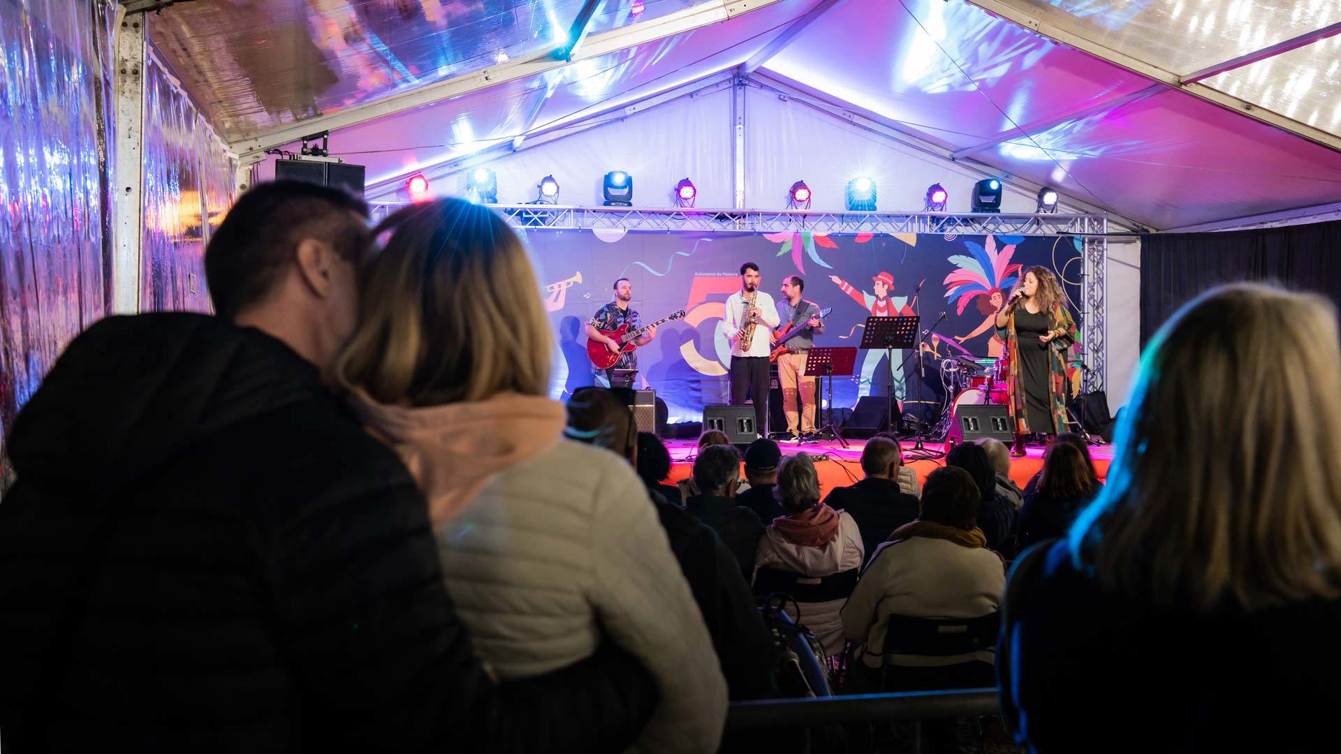 Carnival concert with people watching the performance.