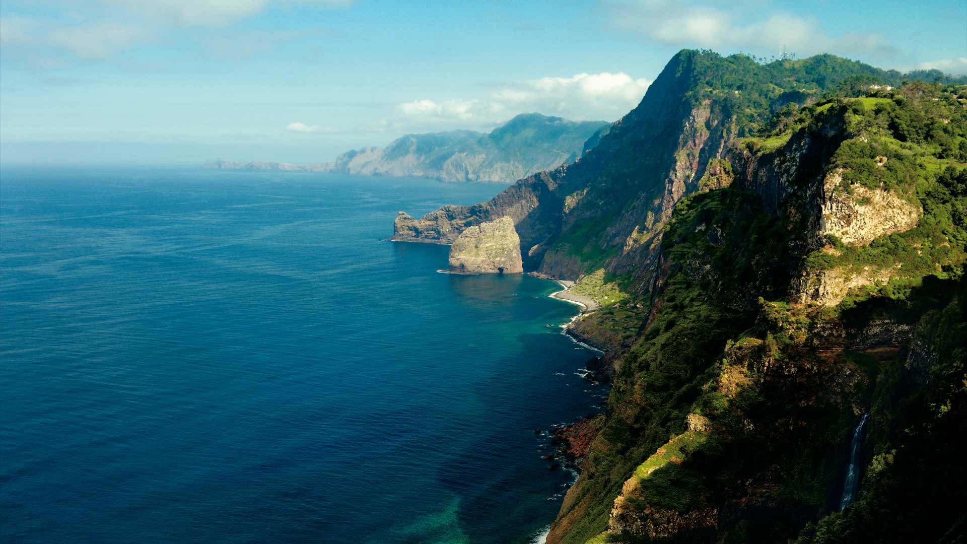 Landscape with green mountains and sea in Madeira.