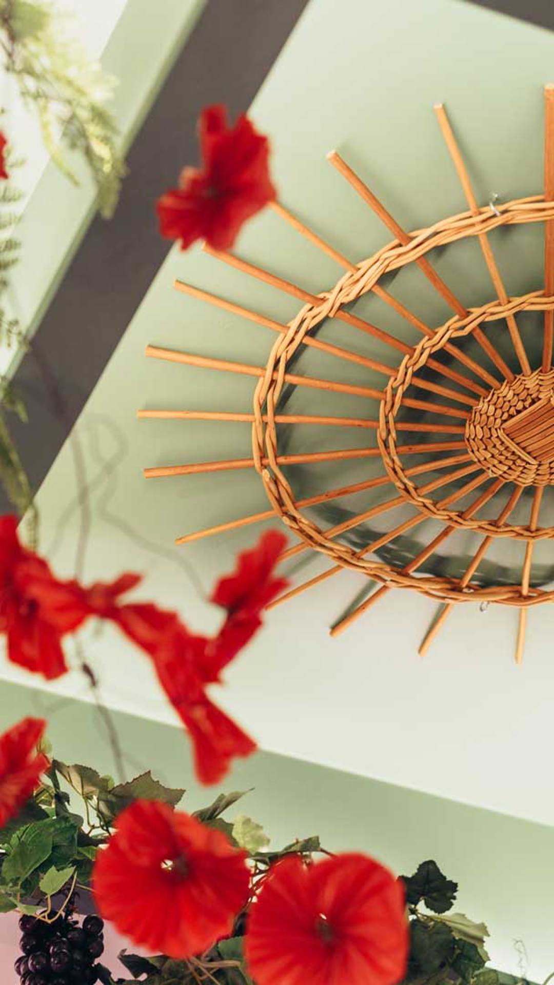 Ceiling of the Madeira Tourism Office in Lisbon decorated with a wicker craft piece.