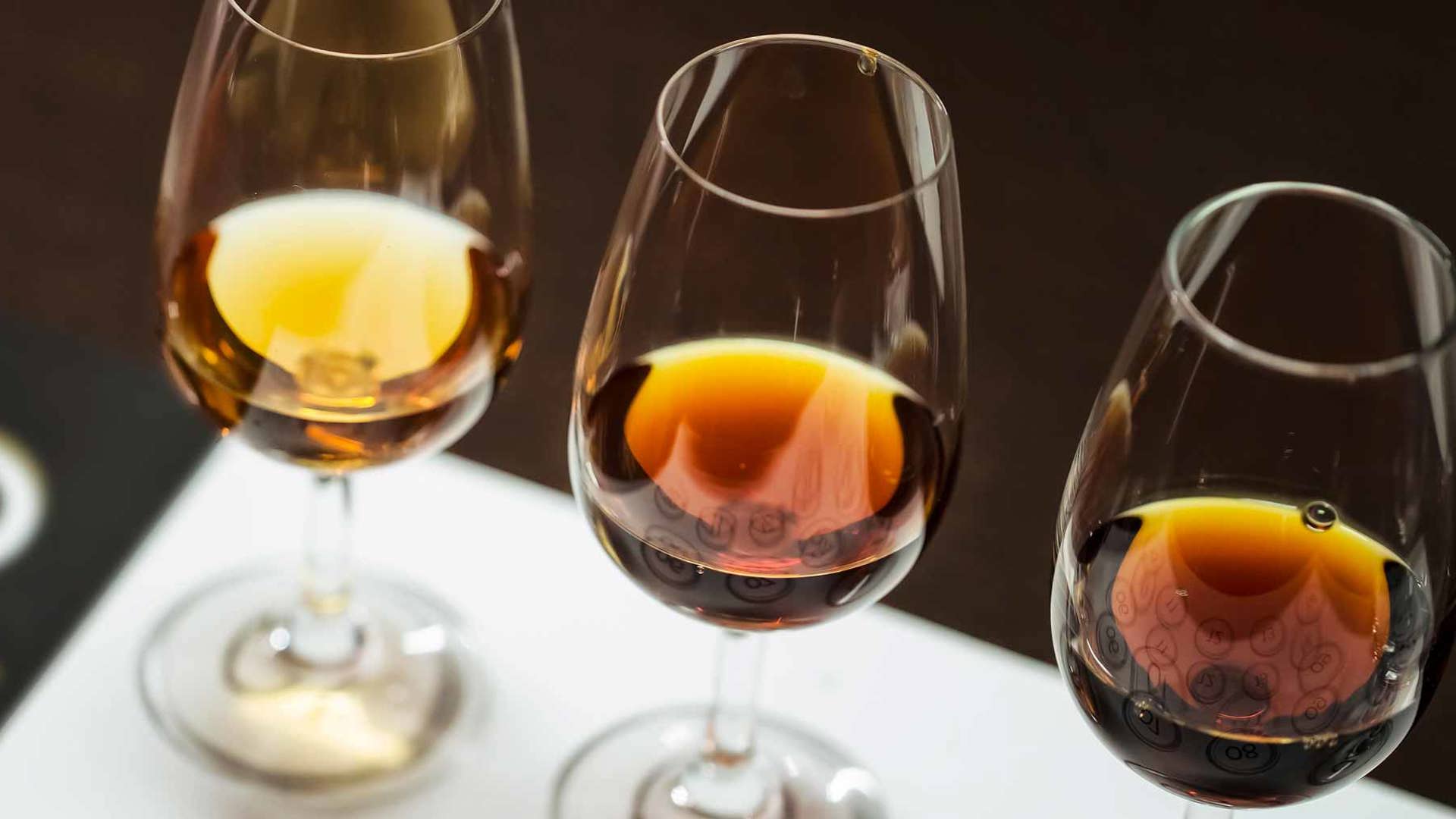 Glasses of Madeira wine on a table.
