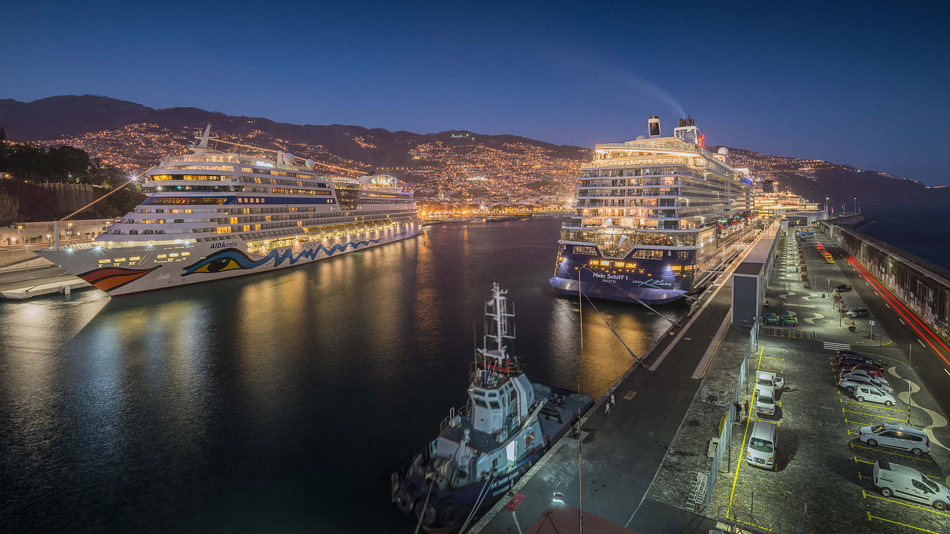 Two cruise ships at the port at night in Madeira.