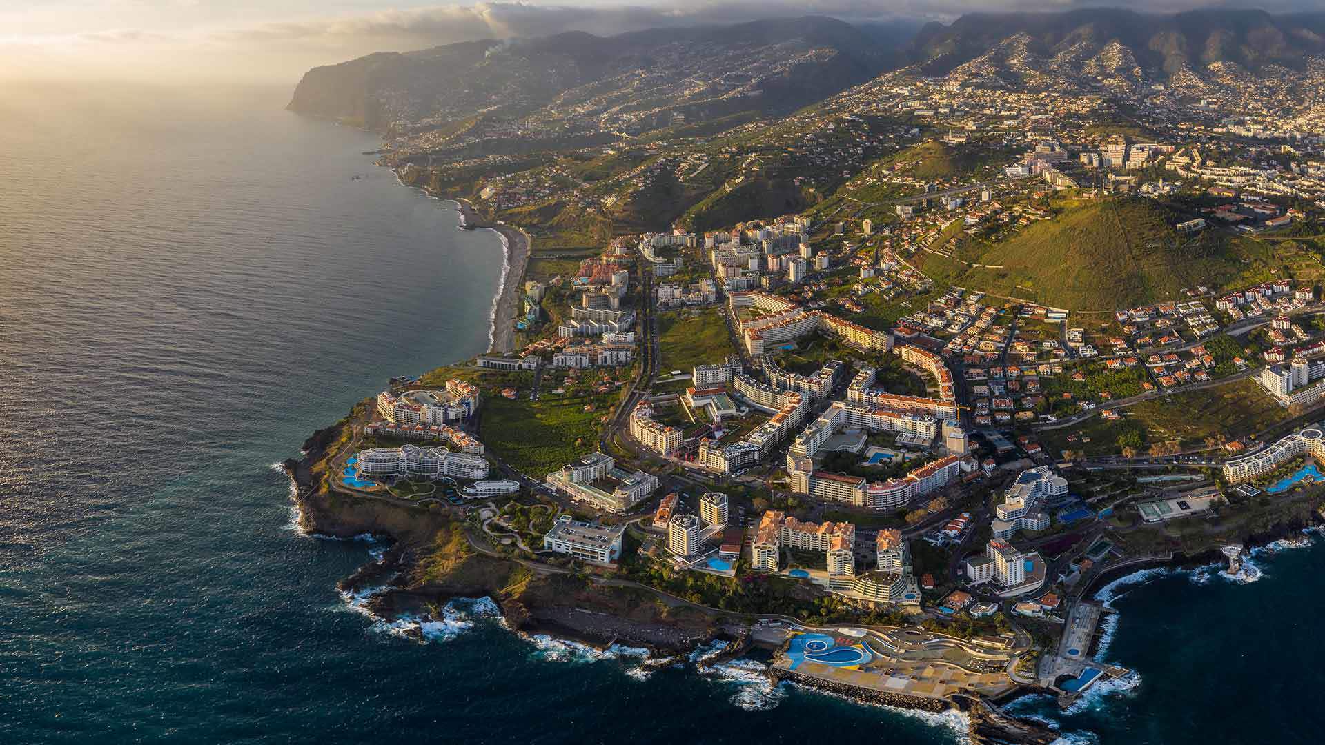 Aerial view of the coast of Madeira Island at sunset.