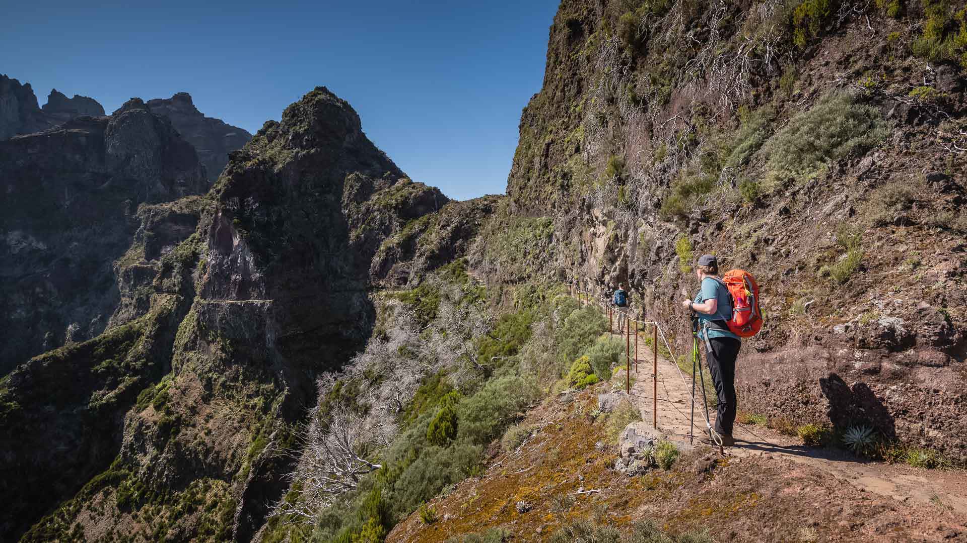 Man walking on a mountain trail in Madeira.