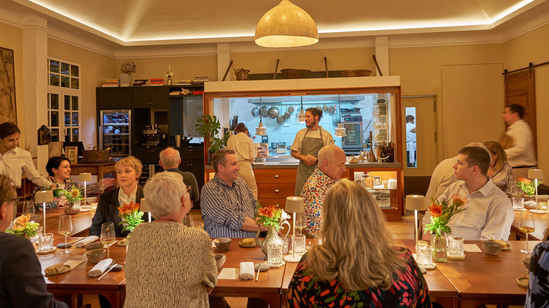 People enjoying a contemporary dining experience in a social setting at a restaurant.
