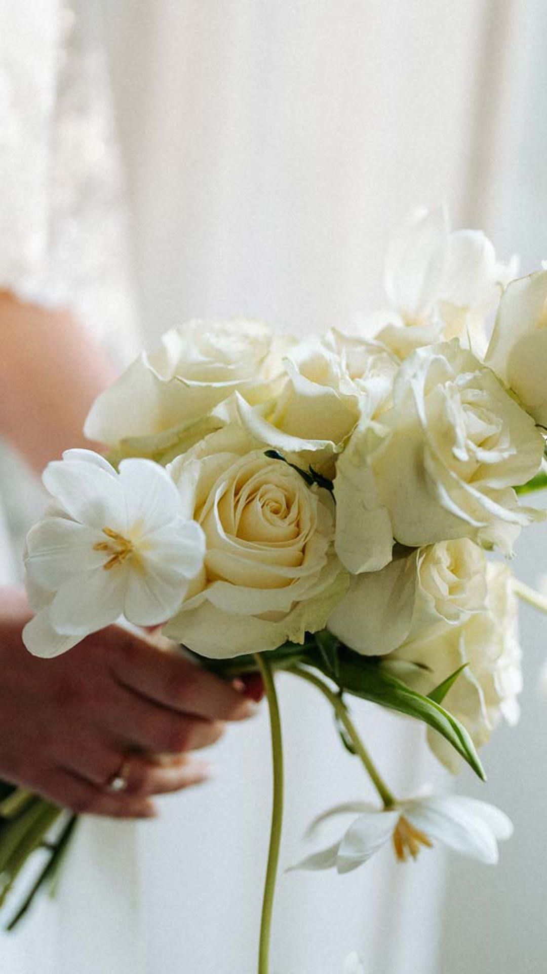 Bride holding a bouquet of flowers.
