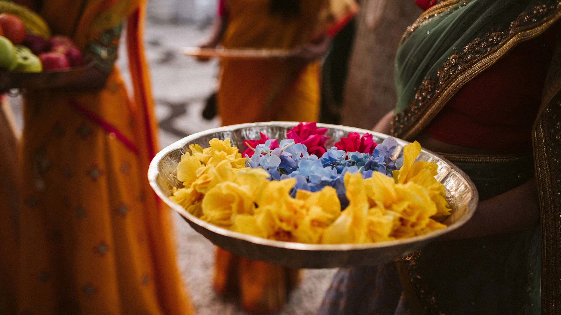 Decorated tray for Indian ceremony with colorful traditional elements.